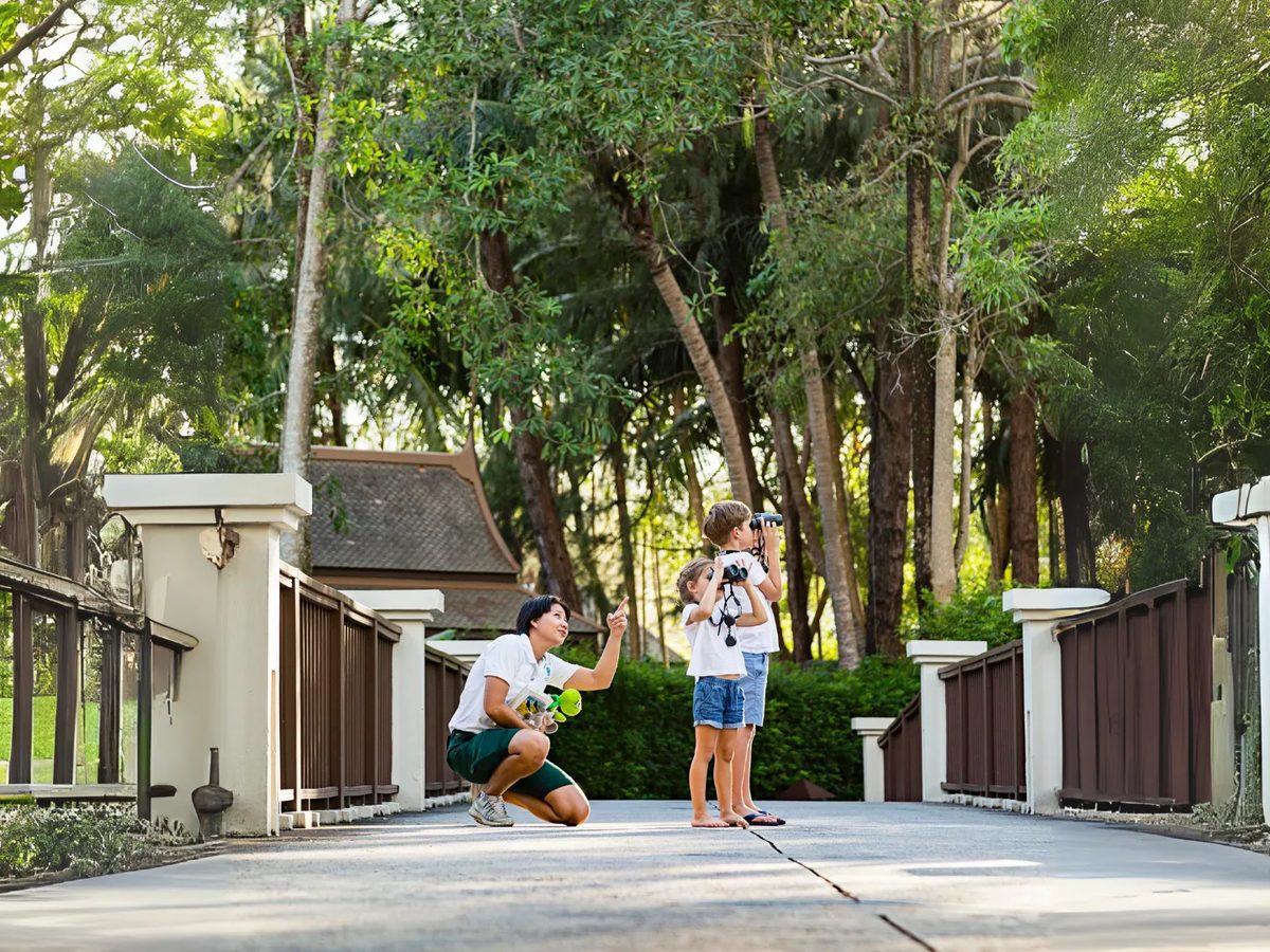Family activity along a garden path at Laguna Phuket